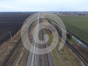 Plot railway. Top view on the rails. High-voltage power lines for electric trains