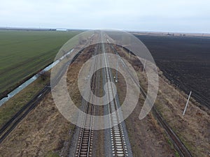 Plot railway. Top view on the rails. High-voltage power lines for electric trains