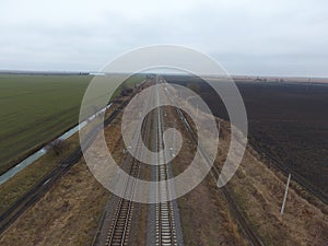 Plot railway. Top view on the rails. High-voltage power lines for electric trains photo