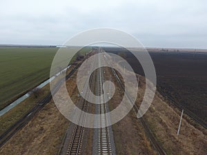 Plot railway. Top view on the rails. High-voltage power lines for electric trains