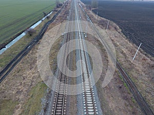 Plot railway. Top view on the rails. High-voltage power lines for electric trains