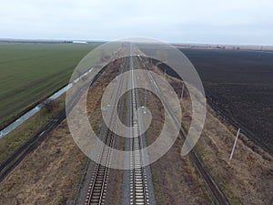 Plot railway. Top view on the rails. High-voltage power lines for electric trains