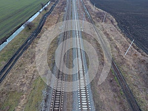 Plot railway. Top view on the rails. High-voltage power lines for electric trains