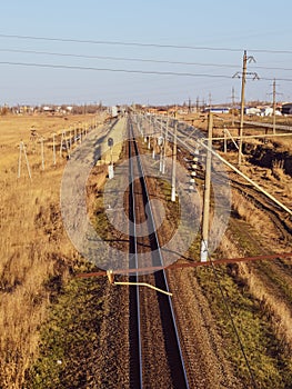 Plot railway. Top view on the rails. High-voltage lines for electric trains photo