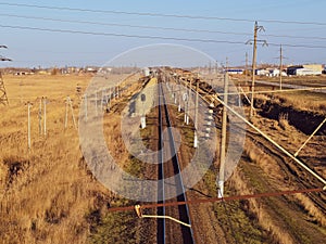 Plot railway. Top view on the rails. High-voltage lines for electric trains photo