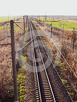 Plot railway. Top view on the rails. High-voltage lines for electric trains photo