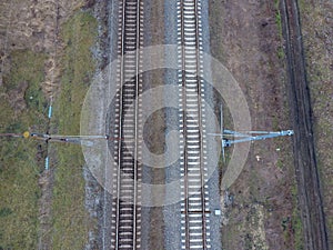 Plot railway. Top view on the rails. High-voltage power lines for electric trains photo