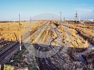 Plot railway. Top view on the rails. High-voltage lines for electric trains photo