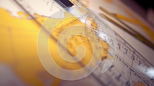 Plotting position on navigational chart at sea. Marine Map and ruler