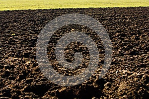 Ploughed soil in agricultural field arable land