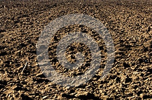 Ploughed soil in agricultural field arable land
