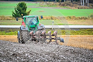 Ploughman ploughing a field in Varmland Sweden