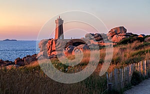 Ploumanac`h Lighthouse in Perros-Guirec on the Pink Granite Coast. photo