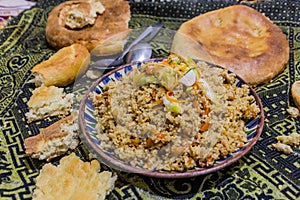 Plov and bread, traditional meal in Tajikist