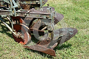 Plow displaying the rear moldboard, share, and coulter