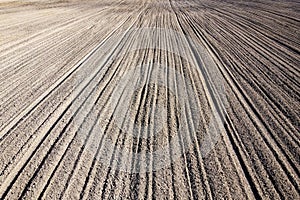 Plowed agricultural field, aerial view. Agricultural land. Background