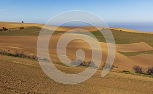Plowed fields and meadows in the mountains