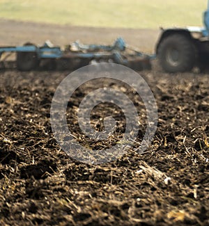 Plowed plowland of black earth in an autumn field.