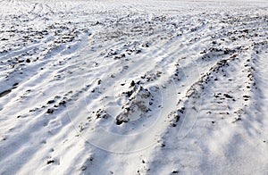 plowed soil under snow