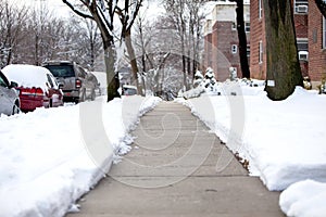 Plowed walkway after a snowstorm