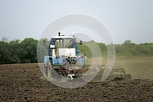 Plowing land for planting with a plow