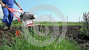 Plowing soil with cultivator and stopping