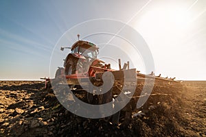 Plowing of stubble field photo