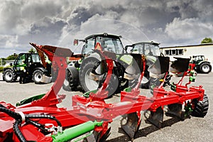 Plows and farming tractors