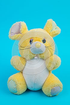 Pluche toy mouse on a blue background