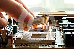 Plug CPU microprocessor to motherboard socket.