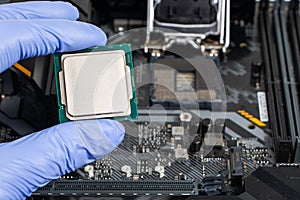 Plug in CPU microprocessor to motherboard socket. Technological background. Concept computers harware