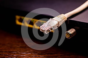 Plug and ethernet cable on the background of sockets in the internet modem