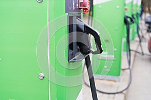 Plug of the green electric charging station