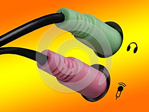 Plug for headphones, headsets and microphone on a computer, orange, yellow background, right side