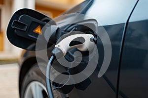 Plug-in hybrid EV car charging at charge station