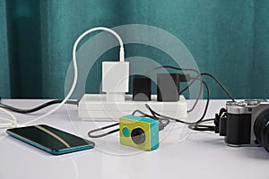 Plug in the power adapter cable to charge various electronic devices, mobile phones, digital cameras and action cameras