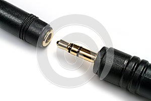 Plug and socket for connecting stereo headphones.