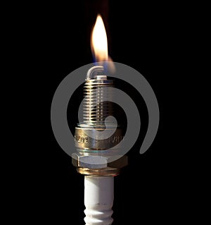 A plug spark with a flame