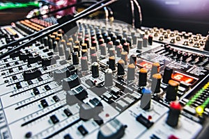 plugged in sound board mixer up close