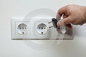 Plugging electrical cable to socket