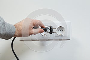 Plugging electrical cable to socket