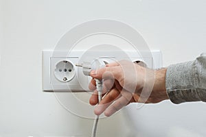 Plugging electrical cable to socket