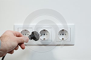 Plugging electrical cable to socket
