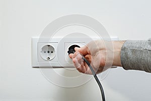 Plugging electrical cable to socket