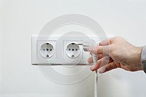 Plugging electrical cable to socket