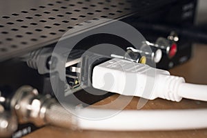 Plugs inserted into the device close up