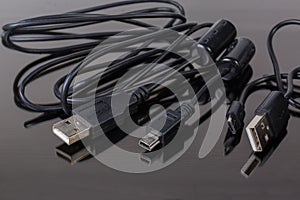 Plugs USB, micro-USB and mini-USB on cables edges