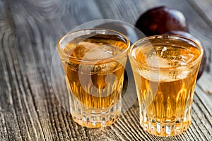 Plum brandy or slivovitz with fresh and tasty plum