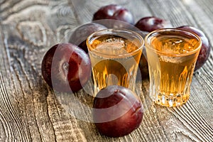 Plum brandy or slivovitz with fresh and tasty plum