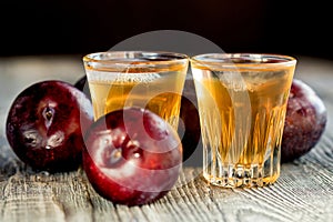 Plum brandy or slivovitz with fresh and tasty plum